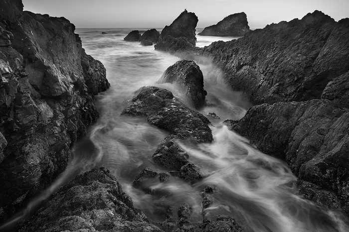 As the tides begin to rise, mighty waves from the Pacific Ocean crash into the rugged rock shores of the Oregon coast. A long...