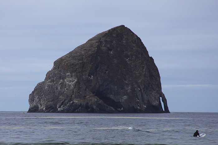 On our way back to Portland we had to stop in Pacific City / Cape Kiwanda To check out their massive Haystack Rock. A surfer...